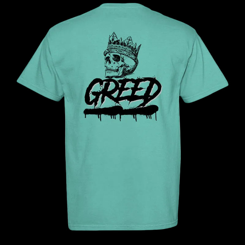 Teal t-shirt with a black graphic design on the back featuring a skull with a crown and the word 'Greed'.