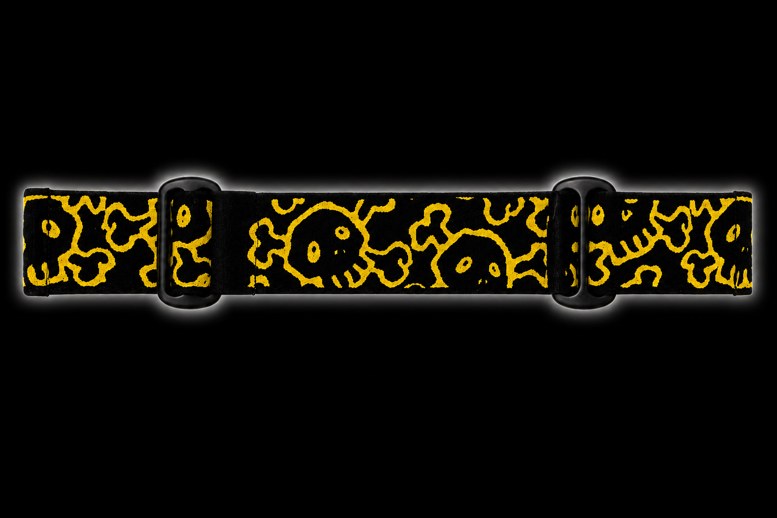 JT Flex paintball goggle strap featuring an all-over GREED skull pattern in gold on a black elastic strap with black adjustment hardware