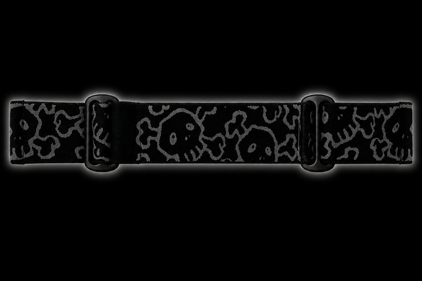 JT Flex paintball goggle strap featuring an all-over GREED skull pattern in grey on a black elastic strap with black adjustment hardware